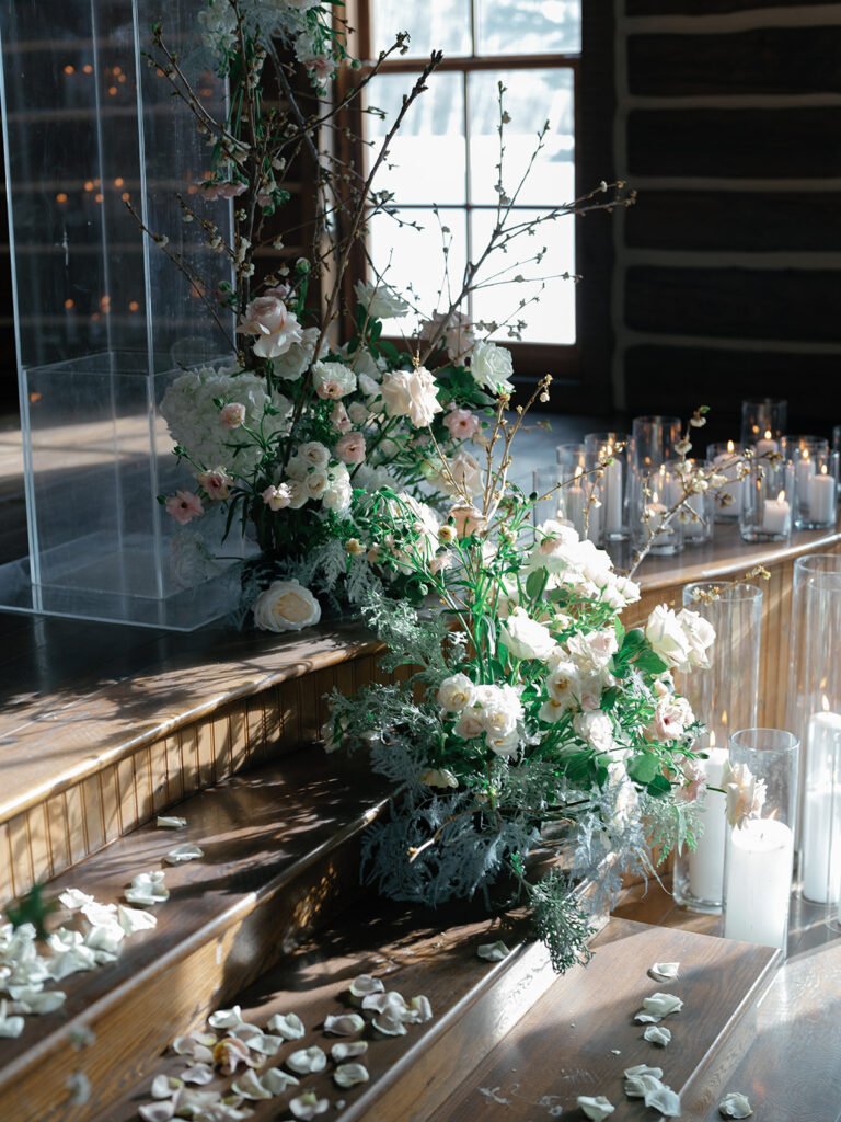 Ceremony florals on steps at brush creek ranch