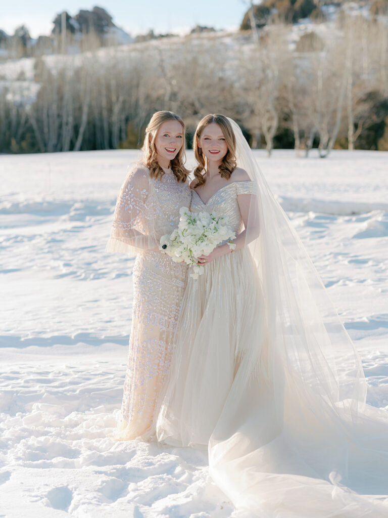 bride and bridesmaid portrait winter wedding brush creek ranch