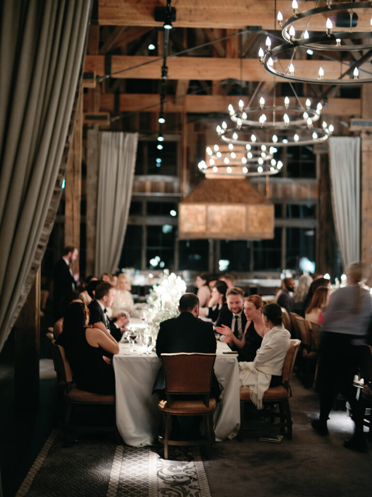 Guests enjoying dinner at Brush Creek Ranch wedding.