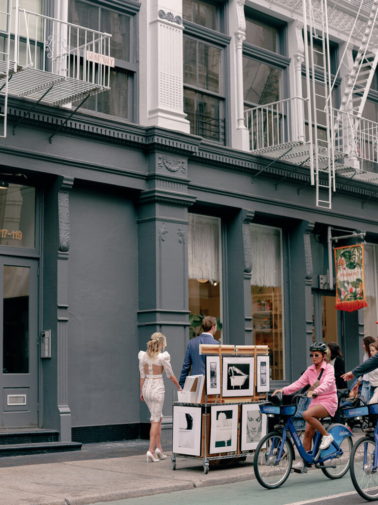 Couple strolling through the streets of New York City for their engagement session.