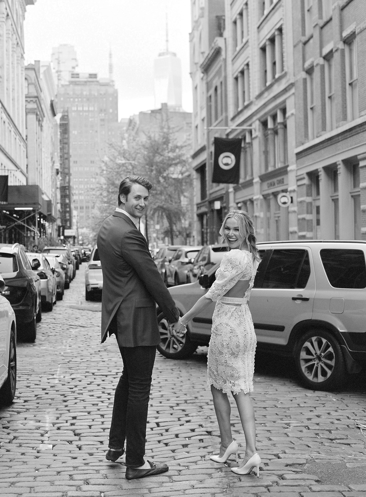 Couple posing in downtown New York for their couple portraits.