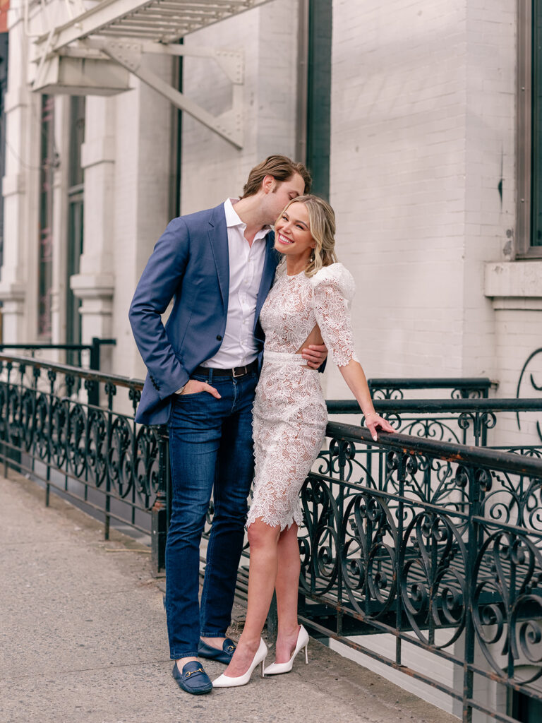 A couple smiling during their New York City engagement session.