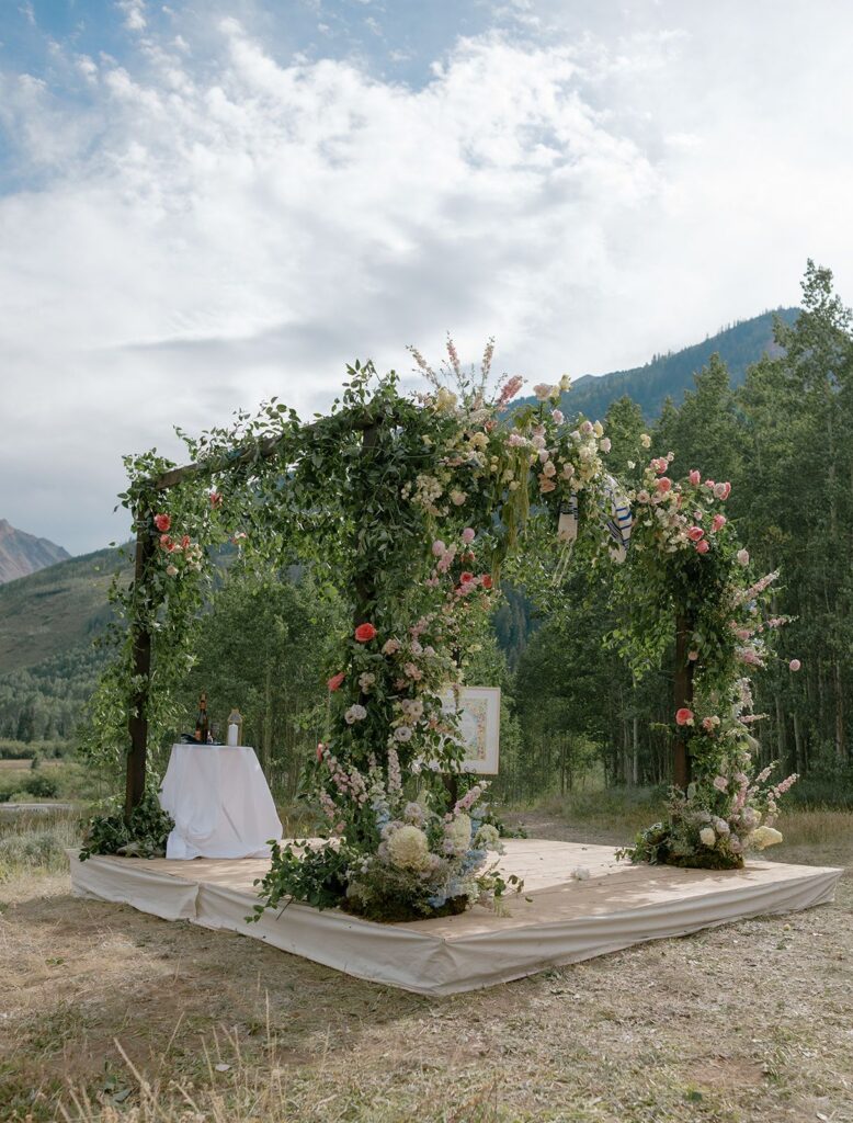 Aspen floral wedding chuppah