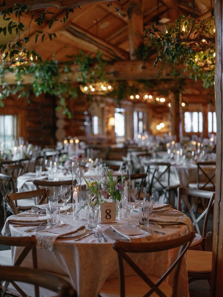 Pine Creek Cookhouse Wedding reception with greenery and candles